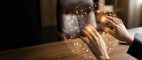Business professional hands holding glowing digital brain with network connections representing artificial intelligence and innovation in modern office.
