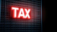 Glowing red neon tax sign mounted on metal grid wall creates dramatic lighting effect against dark background, representing financial and business concepts.