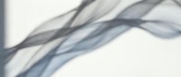 Abstract flowing smoke waves in soft gray and blue tones creating elegant curved lines against light background for modern design projects.