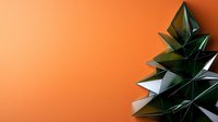 Minimalist geometric dark green origami Christmas tree shape on vibrant orange background with copy space, modern festive holiday concept for design projects.