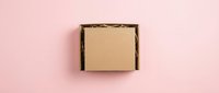 Open cardboard box with kraft paper interior on pink background, ready for product packaging, shipping, and design mockups.
