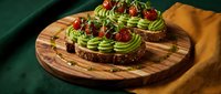 Avocado toast with tomato and microgreens on wooden board, healthy breakfast or lunch option for food blogs, restaurants, and culinary publications.