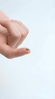 Close-up of a hand holding a tiny microchip on white background, representing technology, innovation, and miniaturization for electronics and computing concepts.
