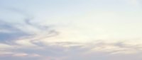 Soft pastel sky with gentle clouds at sunset creating dreamy atmosphere for backgrounds, meditation apps, wellness content, and peaceful design projects.