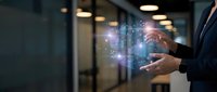 Businessman hands holding glowing digital holographic data visualization with charts and graphs in modern office environment for business analytics.