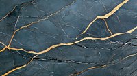 Dark gray marble with golden veins creating elegant natural pattern on polished stone surface. Luxury material for interior design and architecture.