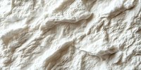 White crumpled paper texture with rough surface and natural shadows creating abstract relief pattern. Suitable for backgrounds and design projects.