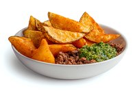 Crispy potato wedges served with seasoned ground beef and fresh chimichurri sauce in white ceramic bowl on white background, appetizing comfort food meal.