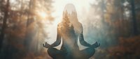 Woman meditating in lotus pose with forest landscape double exposure overlay, mindfulness and wellness concept for yoga, meditation, mental health and spiritual practice.