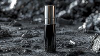 Black cosmetic bottle on dark textured surface with rocks and dramatic lighting, luxury skincare product mockup for beauty and wellness branding.