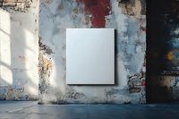 Blank white canvas on weathered wall with exposed brick and peeling paint, creating artistic contrast for gallery or interior design mockup.