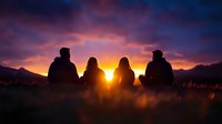 Silhouettes of four friends sitting together watching dramatic purple sunset over mountain range. Peaceful moment of connection and contemplation in nature.