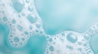 Abstract turquoise and white foam bubbles creating organic flowing patterns with soft aqua tones for modern design backgrounds and creative projects.