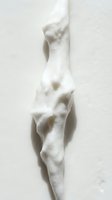 White marble sculptural form with organic flowing curves and abstract contours, isolated on neutral background, suitable for art, design, and creative projects.