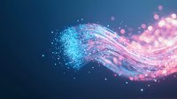 Glowing pink and blue particles flowing in wave pattern against dark background, creating magical light trail effect with bokeh and sparkle elements.