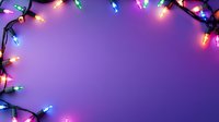 Colorful Christmas lights creating festive border frame on purple gradient background with copy space for holiday messages and seasonal designs.