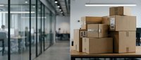 Stacked cardboard shipping boxes in modern office warehouse space with glass partitions and industrial lighting for logistics and delivery concepts.