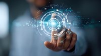 African American businessman interacting with futuristic holographic interface, digital transformation concept showing circular HUD elements and data visualization.