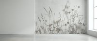 Minimalist interior with botanical wall mural featuring delicate grass silhouettes in neutral tones, empty room with concrete floor and natural window light.