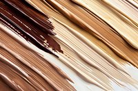 Abstract diagonal strokes in warm brown and beige tones create dynamic texture and movement on light background, suitable for modern design projects and backgrounds.