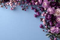 Purple and pink ranunculus flowers with delicate cherry blossoms create elegant floral border frame on light blue background, perfect for wedding stationery.