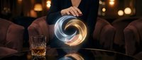 Professional businessman in suit touching glowing spiral hologram at modern office desk with whiskey glass creating futuristic technology atmosphere.