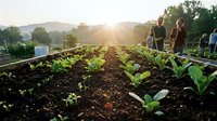 Young diverse farmers tending organic vegetable garden at sunset with fresh green crops growing in fertile soil rows for sustainable agriculture harvest.