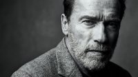 Middle-aged Caucasian man with distinctive facial features, salt-and-pepper hair and stubble, wearing a textured sweater in monochrome studio portrait for character, professional headshot, or editorial use.