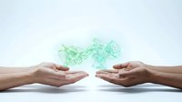 Digital network connection between hands with glowing green geometric nodes representing data transfer, communication technology and business collaboration.