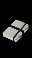 Stack of gray pocket notebooks bound with black elastic band, isolated on transparent background. Ready for stationery clipart, print on demand, t-shirt design, and sublimation use.