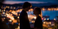 Romantic couple silhouettes against city lights at dusk creating intimate moment with bokeh background for dating apps and relationship content.