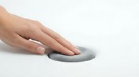 Woman's hand using gray computer mouse on white background for web design and technology concepts.