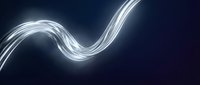 Glowing white light trails flowing in smooth waves across dark background, creating dynamic motion effect for modern design and technology concepts.