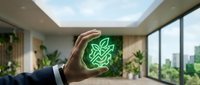 Businessman holding glowing green leaf neon sign in modern office with plants and city skyline view, representing sustainability and eco-friendly business innovation.