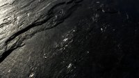 Dark wet asphalt road surface with water droplets and reflective texture for transportation and infrastructure backgrounds.