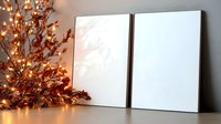 Blank white canvas frames with autumn branches and warm lights creating cozy seasonal home decor atmosphere for artistic projects and interior design.
