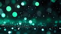 Magical turquoise bokeh lights floating in dark space with glitter particles creating dreamy atmospheric effect. Perfect for festive or fantasy backgrounds.