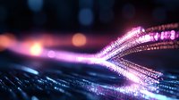 Glowing fiber optic light trails with pink and purple illumination against dark background create futuristic technology concept with bokeh effect and motion blur.