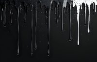 White paint drips flowing down on black background creating dramatic contrast effect with varied lengths and textures. Artistic abstract composition for design projects.