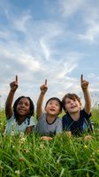 Three diverse children lying on grass pointing up at cloudy sky, expressing wonder and curiosity about nature and world above them.