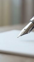 Close-up of elegant fountain pen nib on white paper with soft blurred background for writing, signing documents, business correspondence and legal contracts.