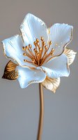 Delicate white porcelain flower with golden stamens and trim against gray background, featuring detailed petals and metallic accents. Elegant botanical art piece.