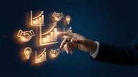 Businessman hand touching glowing neon icons of handshake, growth chart, lightbulb and graph symbols representing business success, partnership and financial growth strategy.