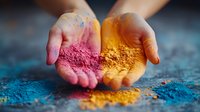Hands holding vibrant pink and yellow powder pigments against blue background, showcasing natural color diversity for art, cosmetics, and festival celebrations.