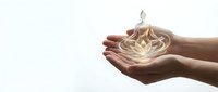 Hands holding glowing lotus flower symbol representing spirituality, wellness, meditation, and inner peace for mindfulness and healing concepts.