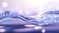 Flowing liquid waves with sparkling bokeh effects in purple and blue tones create dynamic motion against blurred background, suitable for abstract designs.