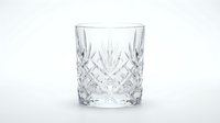 Crystal cut glass tumbler with diamond pattern design isolated on white background for luxury drinkware and barware concepts.