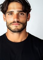 Mediterranean male model with dark wavy hair and beard wearing black t-shirt against white background, close-up portrait showing confident expression.