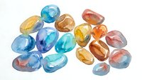Watercolor gemstones and precious stones in blue, amber, and rose tones isolated on white background, suitable for jewelry design, luxury branding, and decorative applications.