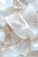 Translucent white crystal chunks arranged in abstract composition with soft beige undertones, creating ethereal mineral texture for wellness and spa designs.
